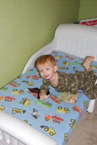 Jordan on his new-to-him bed, that he still hasn't slept in.